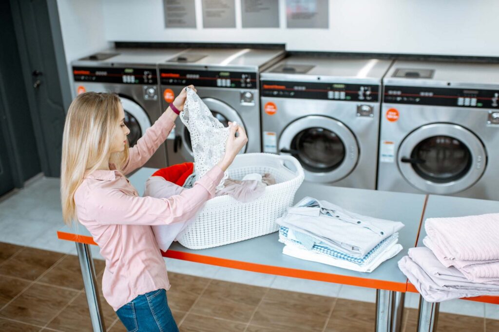 woman sorting clothes in the laundry 9lnct23 2048x1365